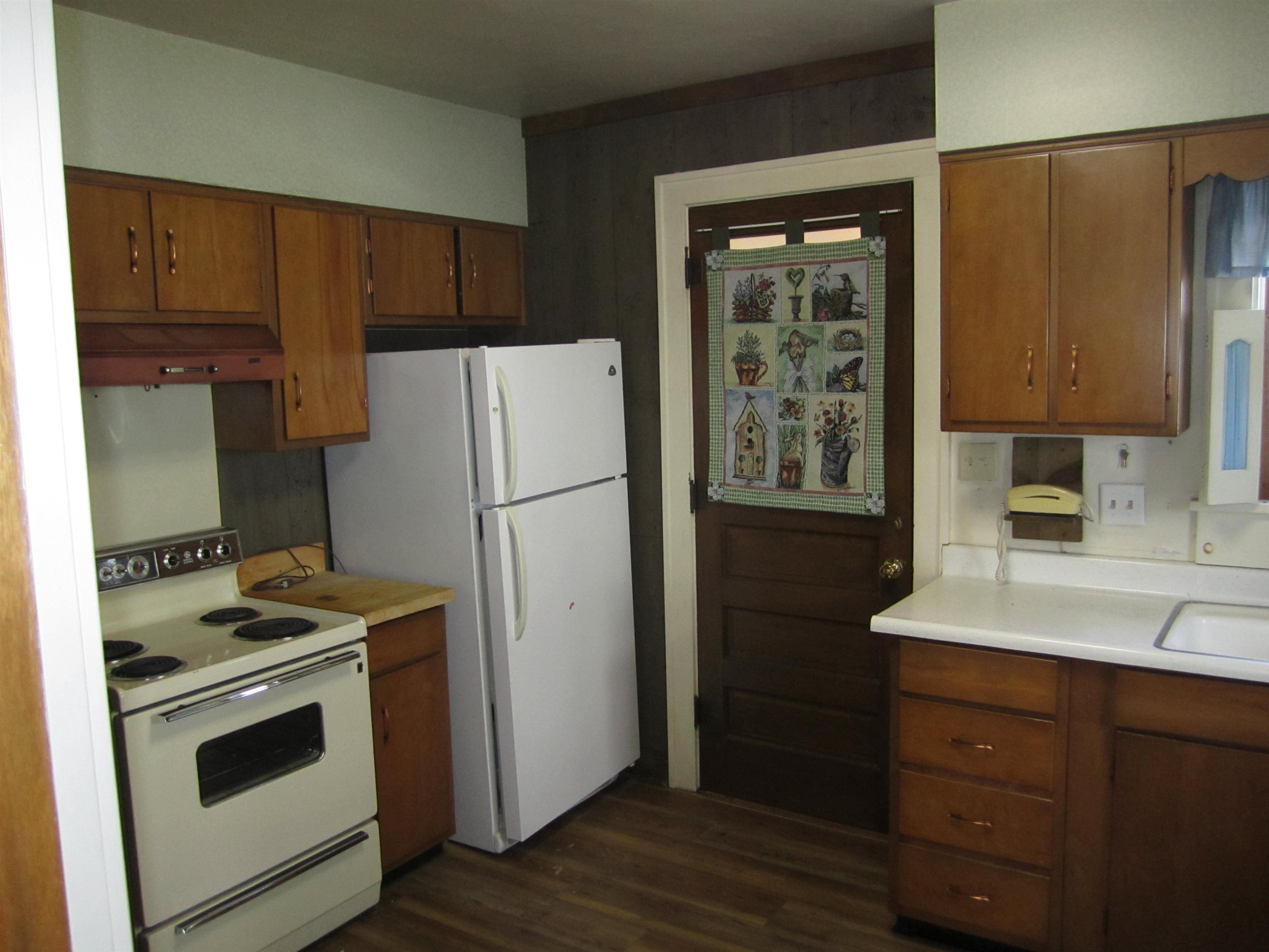 1107 South Main Street Belvidere, IL 61008 - Photo 8 of 21 a kitchen with a refrigerator stove and sink