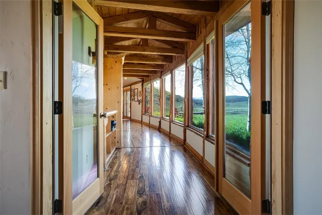 a view of balcony with wooden floor