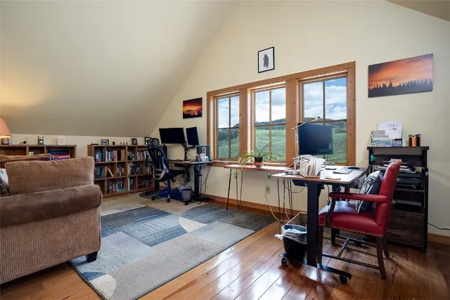 a bathroom with a granite countertop toilet and a sink