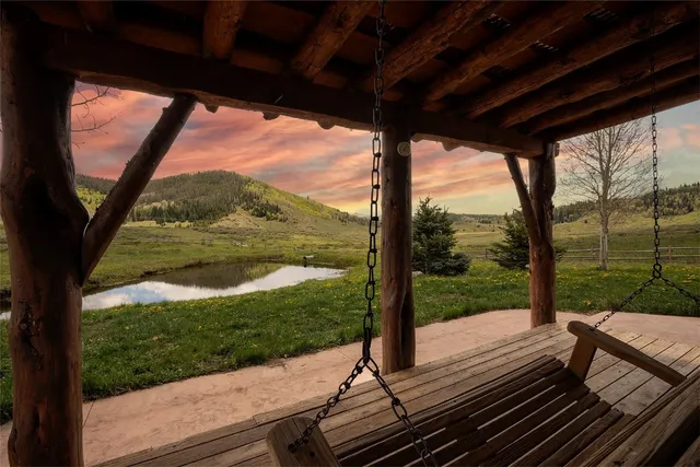 a view of a two chairs in the balcony