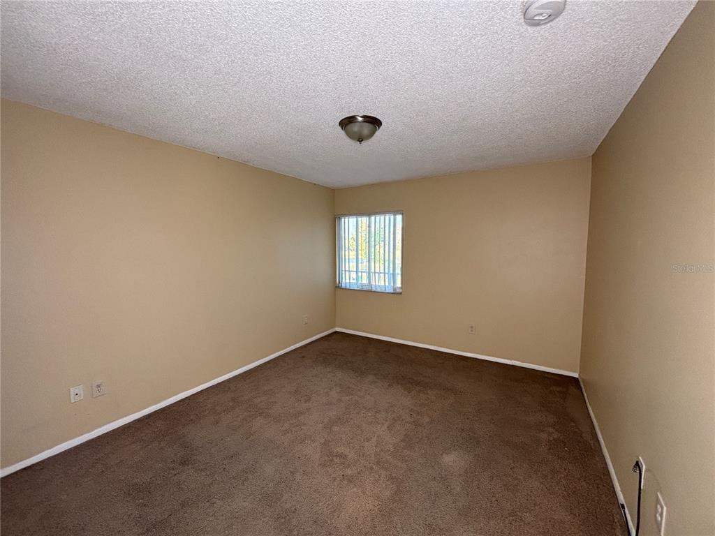 800 North Fiske Boulevard, Unit 815 Cocoa, FL 32922 - Photo 10 of 14 an empty room with windows and entrance