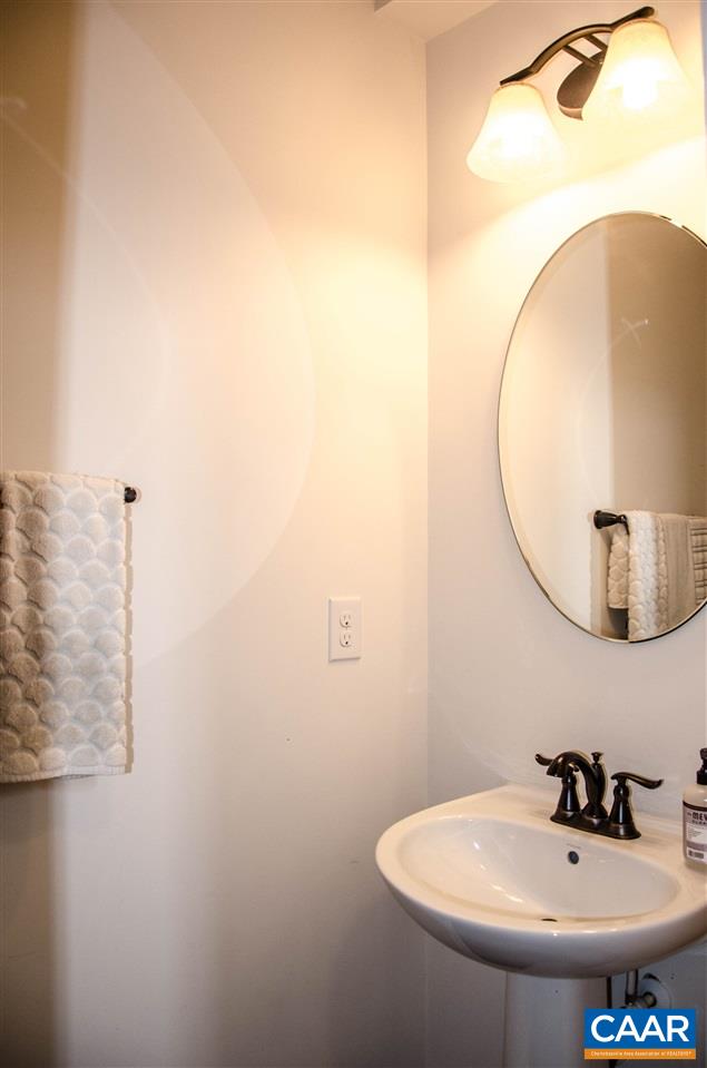292 Ridgemont Road Ruckersville, VA 22968 - Photo 14 of 50 a bathroom with a sink and mirror