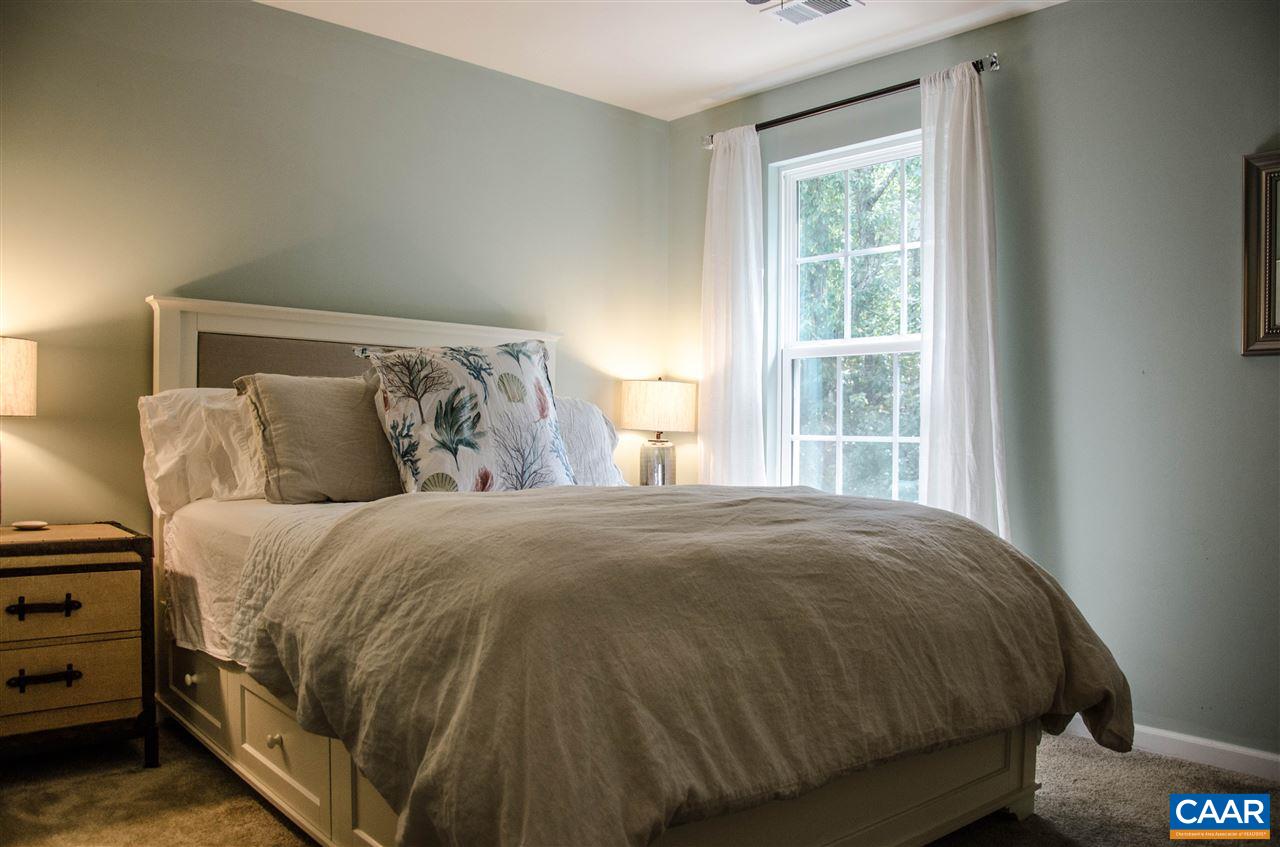 292 Ridgemont Road Ruckersville, VA 22968 - Photo 19 of 50 a bed sitting in a bedroom next to a window