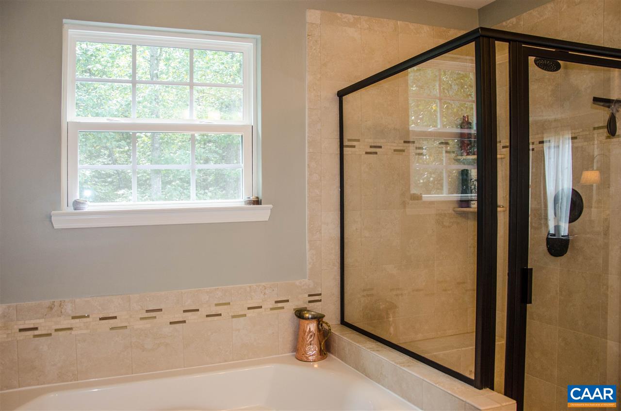 292 Ridgemont Road Ruckersville, VA 22968 - Photo 27 of 50 a bathroom with a bathtub and a shower
