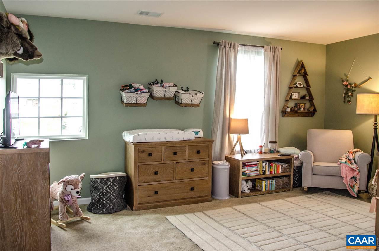 292 Ridgemont Road Ruckersville, VA 22968 - Photo 30 of 50 a room with a bed and a window
