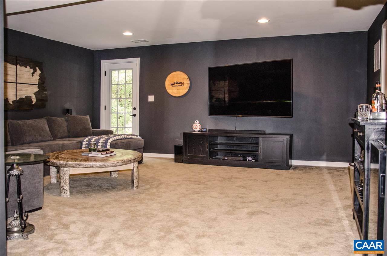 292 Ridgemont Road Ruckersville, VA 22968 - Photo 34 of 50 a living room with furniture and a flat screen tv