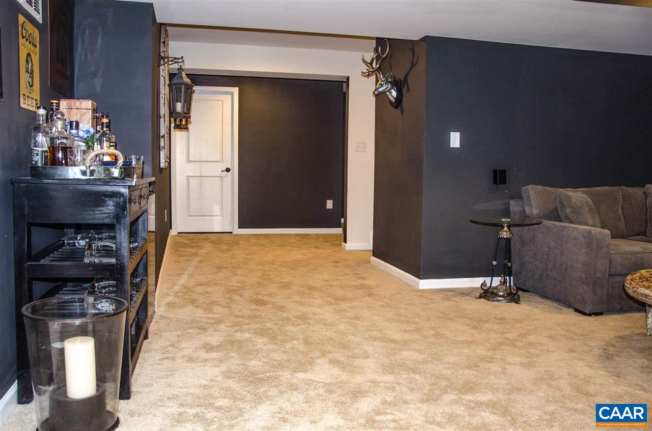 292 Ridgemont Road Ruckersville, VA 22968 - Photo 37 of 50 a view of a livingroom with furniture and an empty room