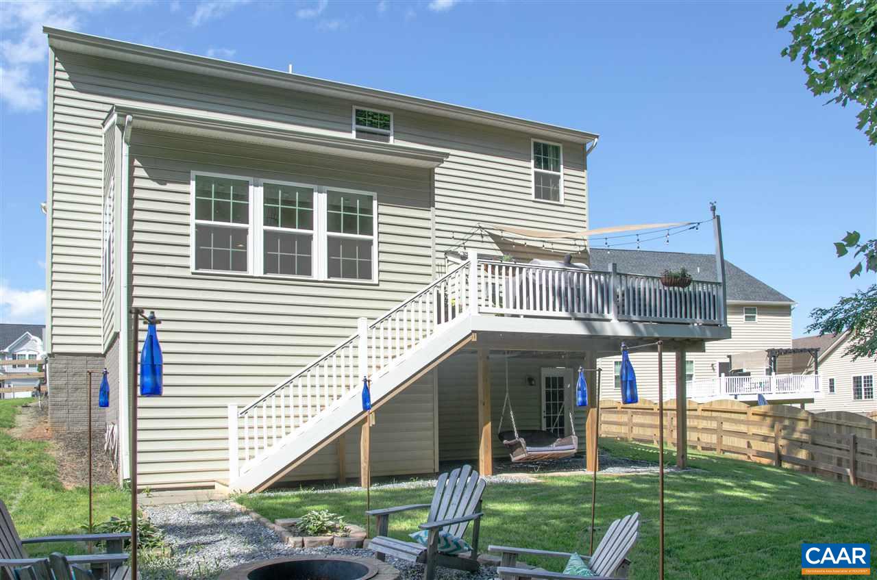 292 Ridgemont Road Ruckersville, VA 22968 - Photo 40 of 50 a view of a house with a yard and a large tree