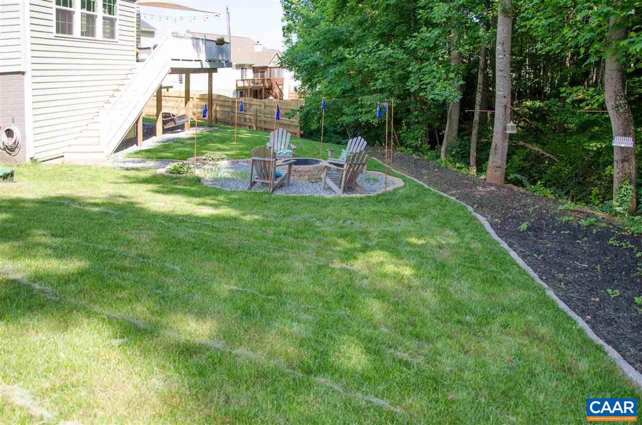 292 Ridgemont Road Ruckersville, VA 22968 - Photo 43 of 50 a view of a chair and table in backyard of the house