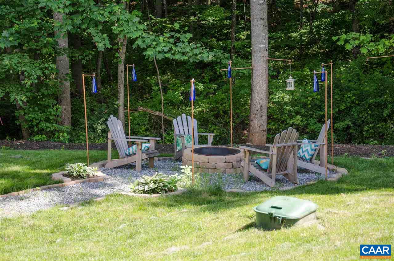 292 Ridgemont Road Ruckersville, VA 22968 - Photo 44 of 50 a view of a chair and table in backyard of a house