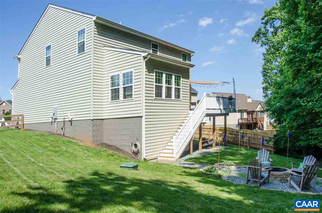 292 Ridgemont Road Ruckersville, VA 22968 - Photo 46 of 50 a backyard of a house with table and chairs