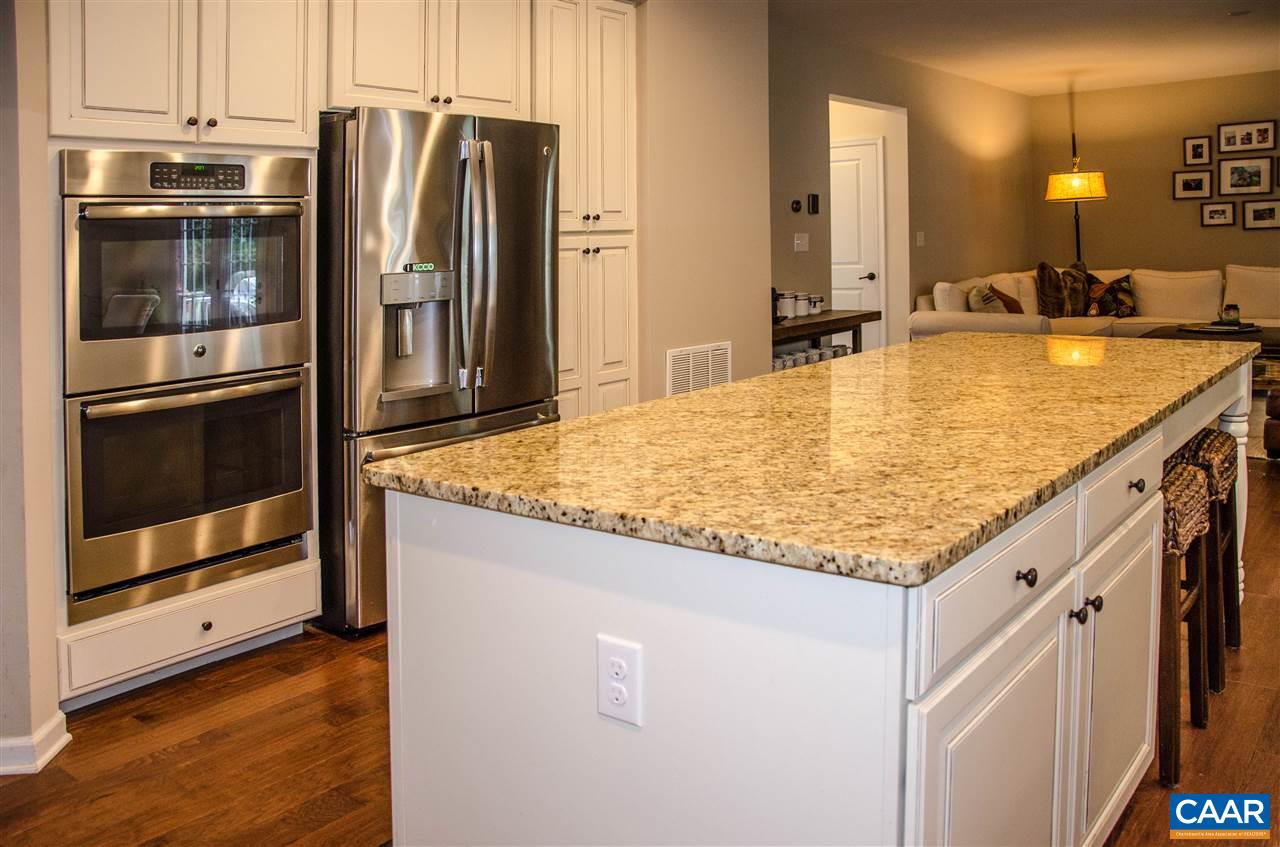 292 Ridgemont Road Ruckersville, VA 22968 - Photo 8 of 50 a kitchen with stainless steel appliances granite countertop a sink and a refrigerator