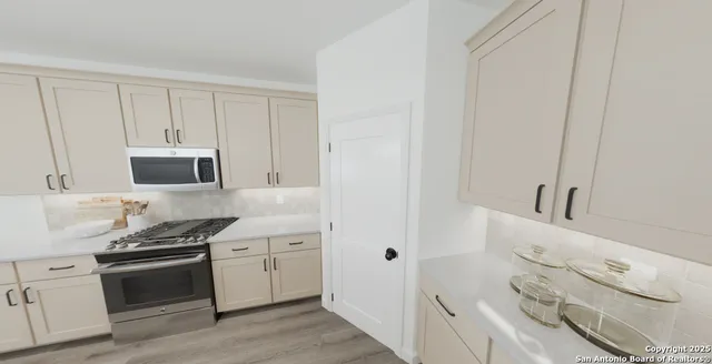 an aerial view of a residential houses with outdoor space