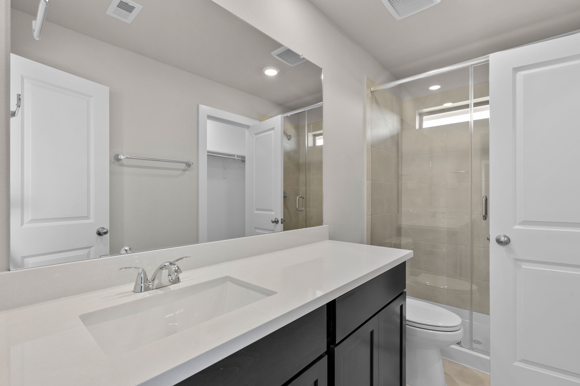 13319 Prado Rdg Lane Rosharon, TX 77583 - Photo 14 of 33 a bathroom with a sink a toilet a shower and a mirror