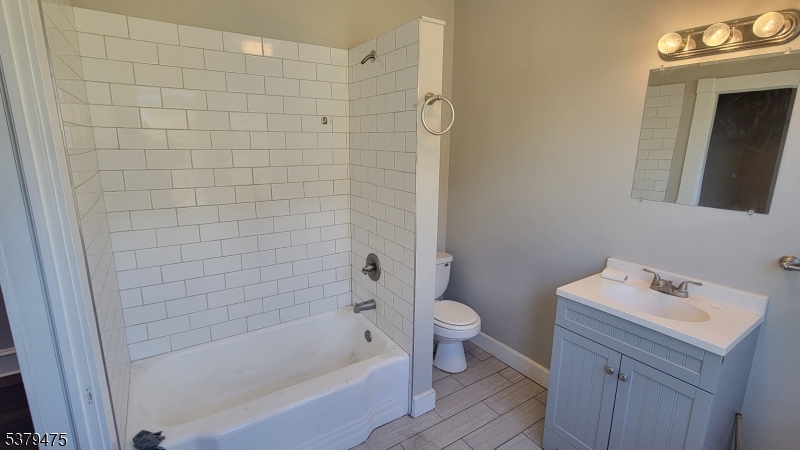 244 Irwin Street Phillipsburg, NJ 08865 - Photo 11 of 15 a bathroom with a sink a toilet and shower