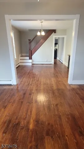 a view of entryway with wooden floor