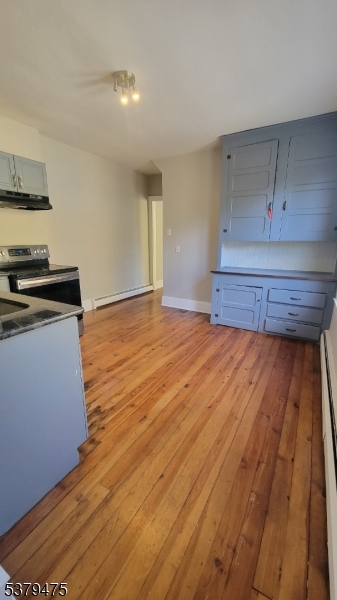 244 Irwin Street Phillipsburg, NJ 08865 - Photo 5 of 15 a kitchen with wooden floors and appliances