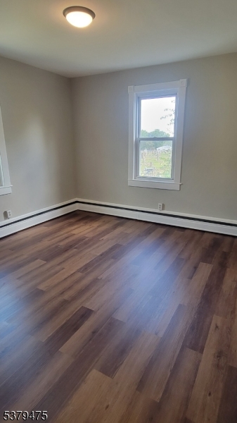 244 Irwin Street Phillipsburg, NJ 08865 - Photo 7 of 15 an empty room with wooden floor and windows