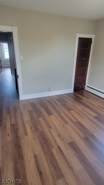 244 Irwin Street Phillipsburg, NJ 08865 - Photo 8 of 15 a view of an empty room with wooden floor and a window