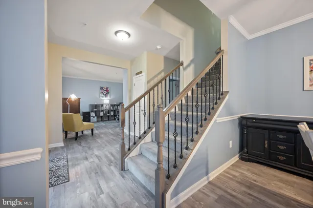 a kitchen with granite countertop a center island stainless steel appliances cabinets and a counter space