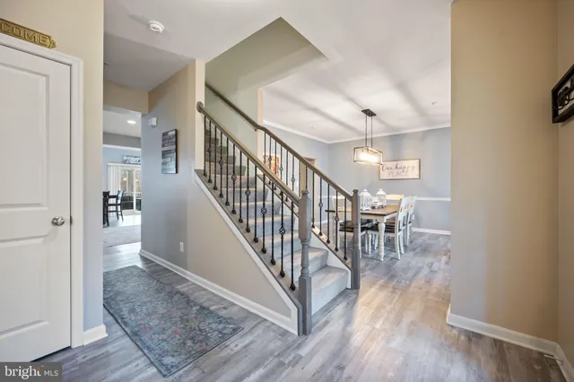 a large kitchen with granite countertop a large counter top stainless steel appliances and cabinets