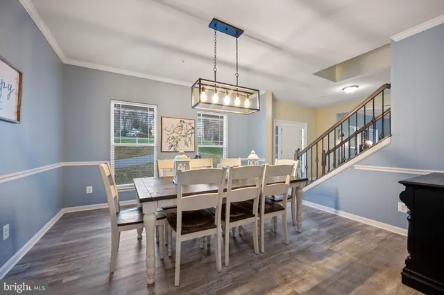a kitchen with granite countertop stainless steel appliances and wooden cabinets