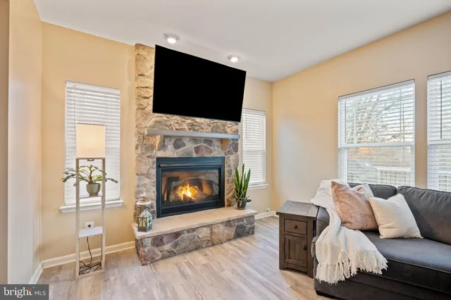 a spacious bedroom with a bed and a lamp