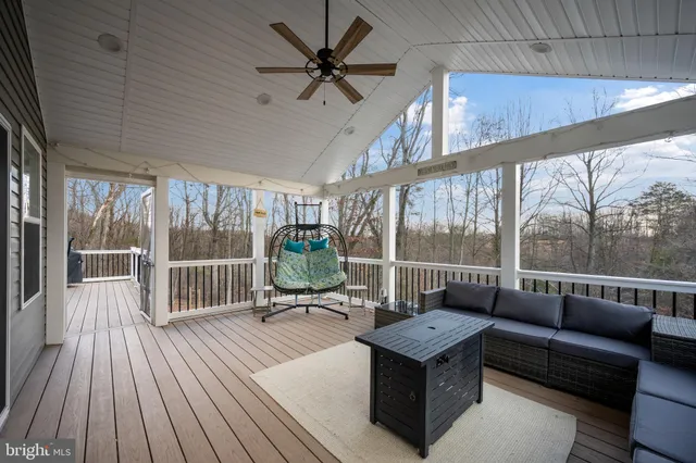 a spacious bedroom with two beds and a flat screen television