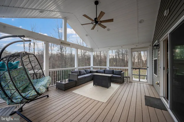 a bathroom with a granite countertop sink a toilet and a mirror