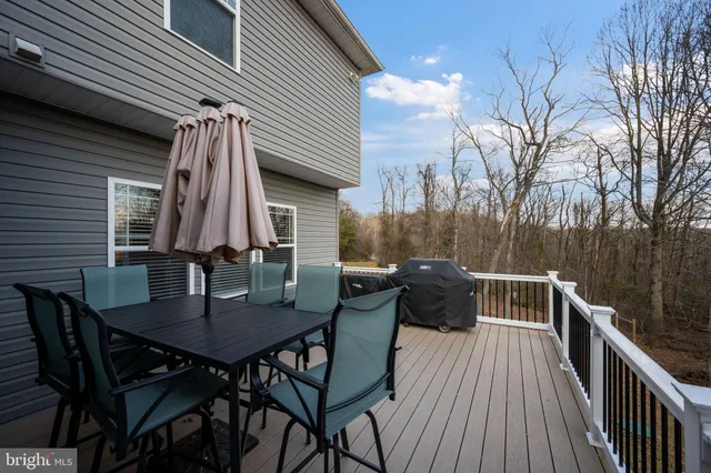 a bedroom with a bed and a desk