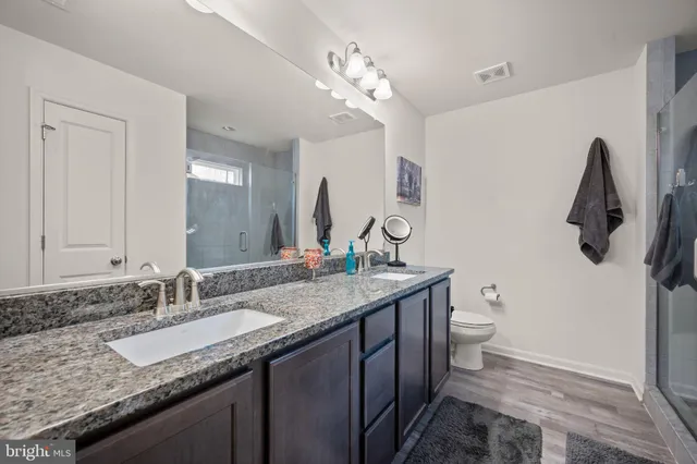 a bathroom with a sink toilet and vanity