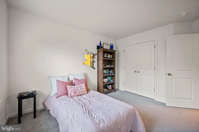 a bathroom with a sink a toilet and shower curtain