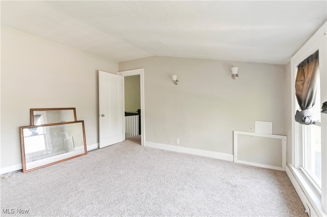 1584 Rydalmount Road Cleveland Heights, OH 44118 - Photo 28 of 36 Unfurnished bedroom with carpet, lofted ceiling, and baseboards