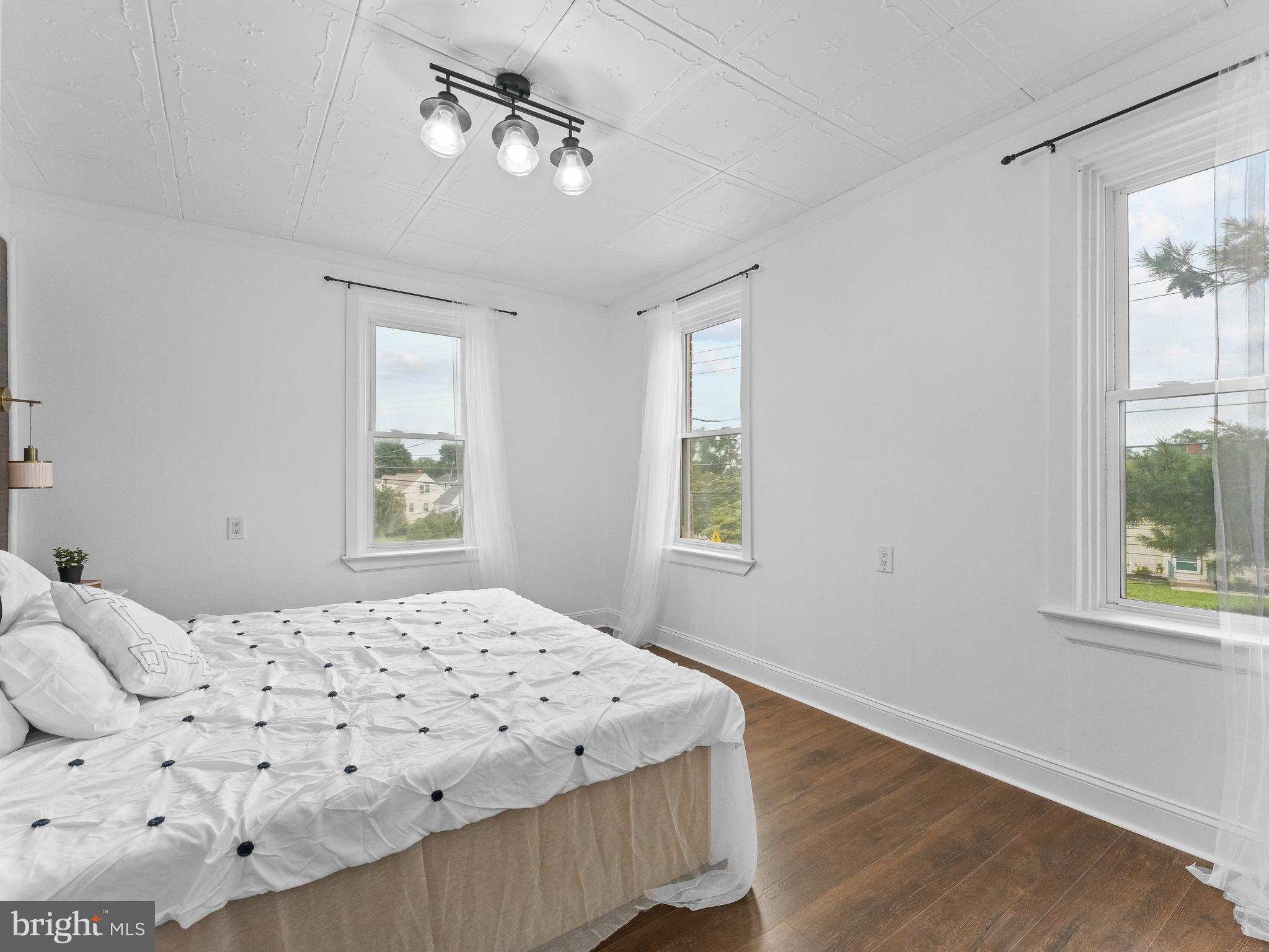 209 Upland Road Brookhaven, PA 19015 - Photo 19 of 39 a bedroom with a large bed and a window