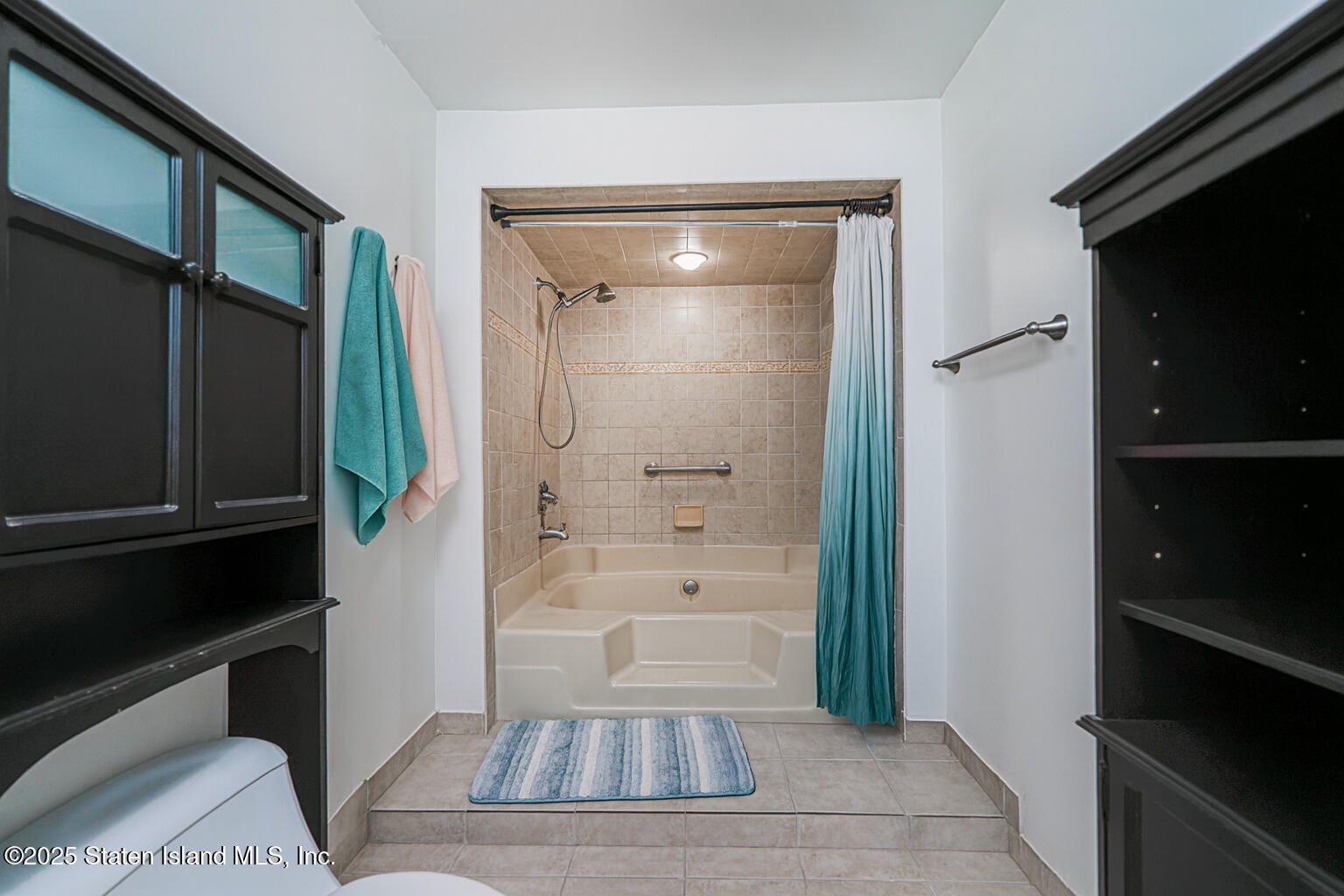 22 Regis Drive Staten Island, NY 10314 - Photo 15 of 22 a bathroom with a glass door shower