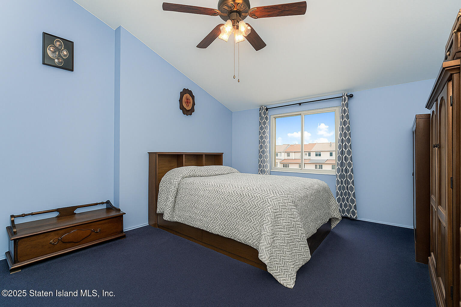 22 Regis Drive Staten Island, NY 10314 - Photo 16 of 22 a bed sitting in a bedroom next to a window