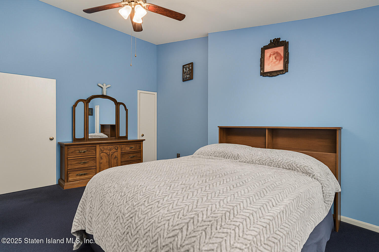 22 Regis Drive Staten Island, NY 10314 - Photo 17 of 22 a bedroom with a bed and a dresser