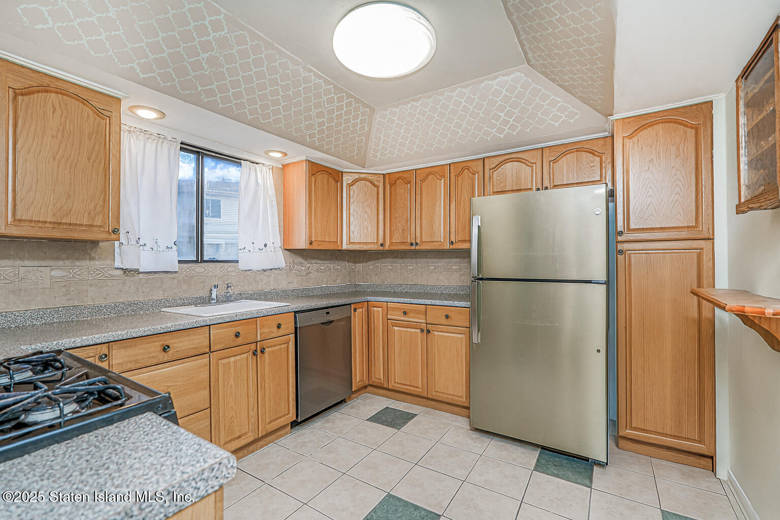 22 Regis Drive Staten Island, NY 10314 - Photo 4 of 22 a kitchen with stainless steel appliances granite countertop a refrigerator sink and cabinets
