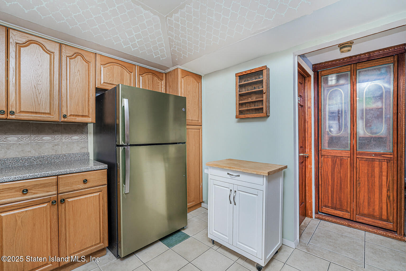 22 Regis Drive Staten Island, NY 10314 - Photo 6 of 22 a kitchen with cabinets and stainless steel appliances