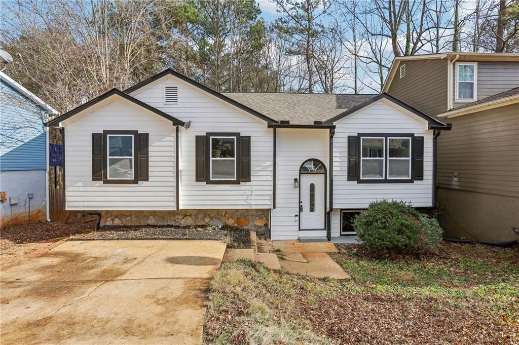 1358 To Lani Farm Road Stone Mountain, GA 30083 - Photo 1 of 1 a bathroom with a sink and mirror