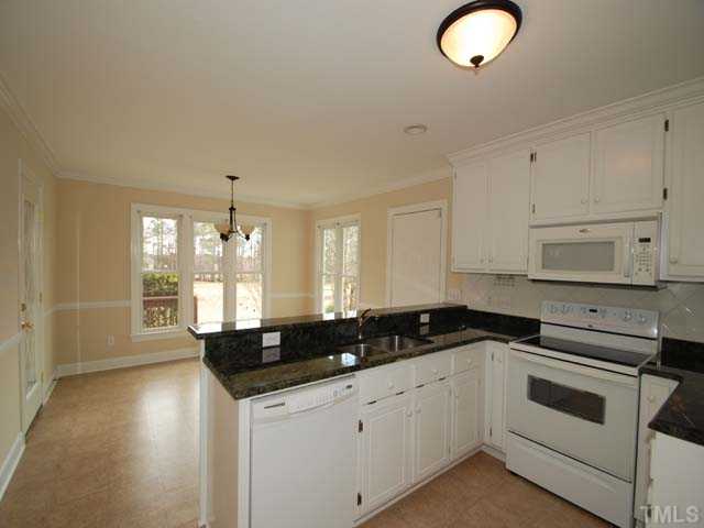 2224 Laurel Valley Way Raleigh, NC 27604 - Photo 4 of 12 Granite counter tops, new appliances and a great view of the golf course