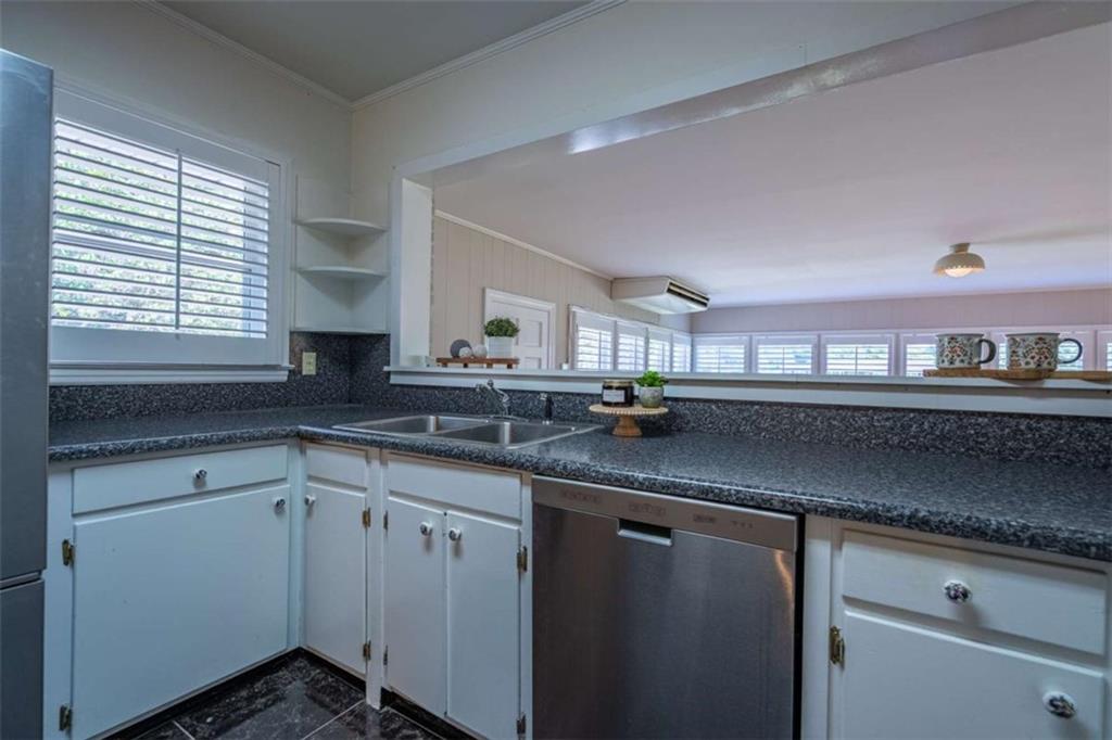 112 College Circle Cedartown, GA 30125 - Photo 13 of 35 a kitchen with cabinets and window