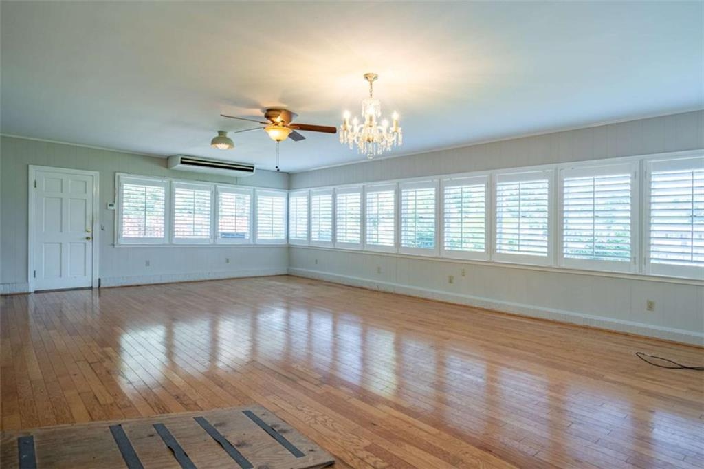 112 College Circle Cedartown, GA 30125 - Photo 16 of 35 an empty room with wooden floor and windows