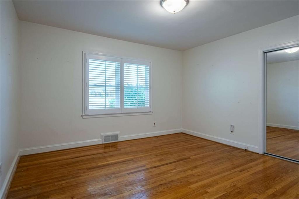 112 College Circle Cedartown, GA 30125 - Photo 19 of 35 wooden floor in an empty room with a window