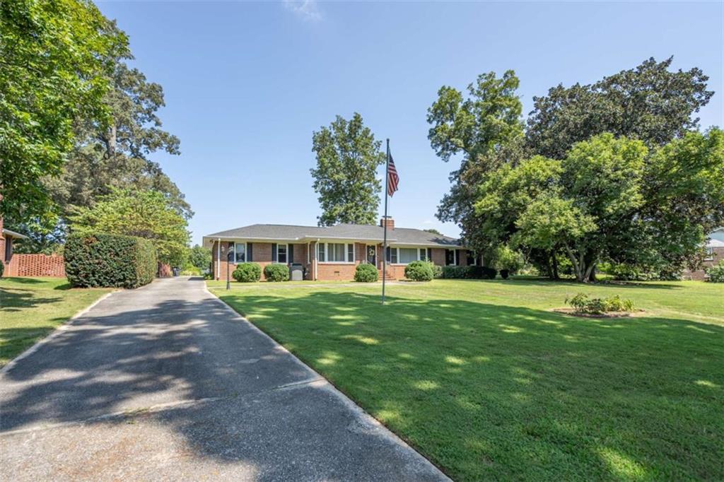 112 College Circle Cedartown, GA 30125 - Photo 2 of 35 a front view of a house with garden