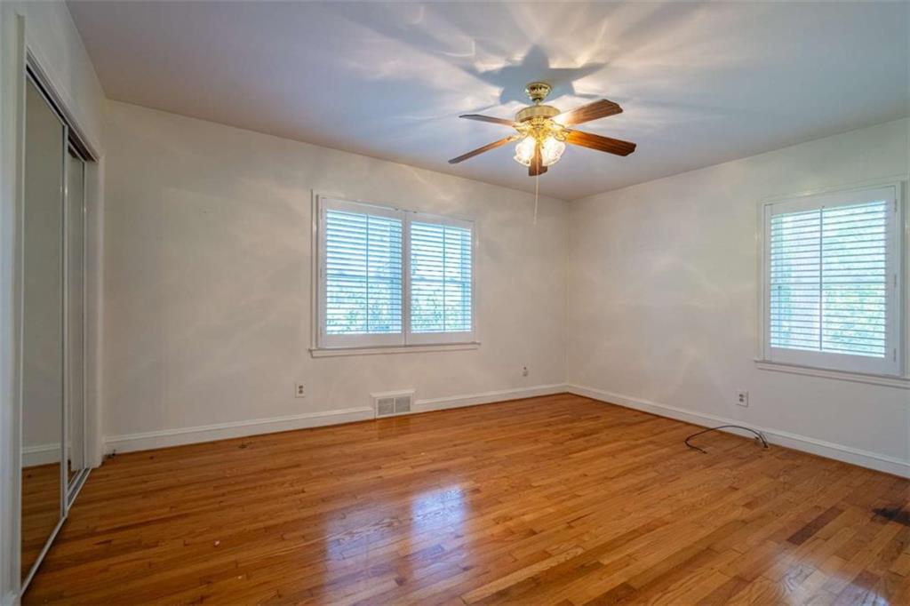 112 College Circle Cedartown, GA 30125 - Photo 21 of 35 wooden floor in an empty room with a window