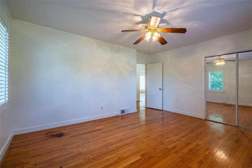 112 College Circle Cedartown, GA 30125 - Photo 22 of 35 wooden floor in an empty room with a window