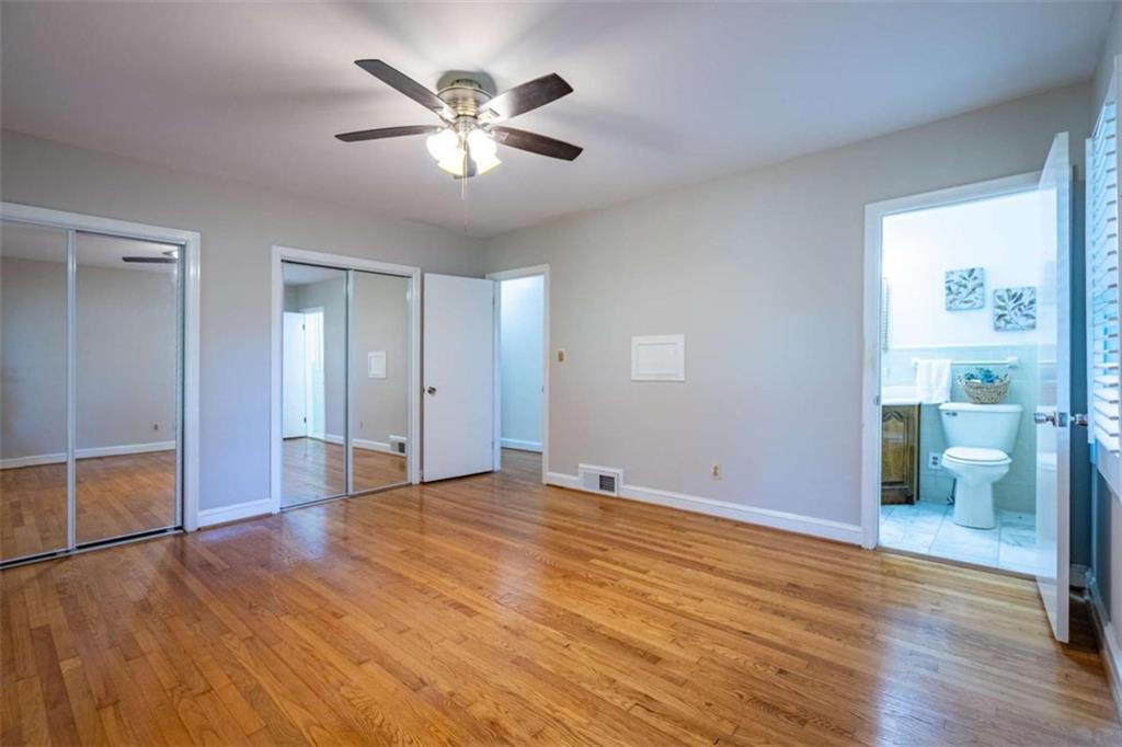 112 College Circle Cedartown, GA 30125 - Photo 24 of 35 an empty room with wooden floor and windows