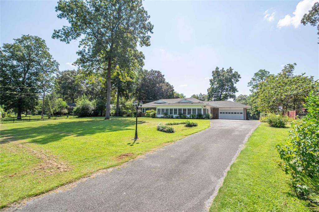 112 College Circle Cedartown, GA 30125 - Photo 30 of 35 a swimming pool with outdoor seating and yard