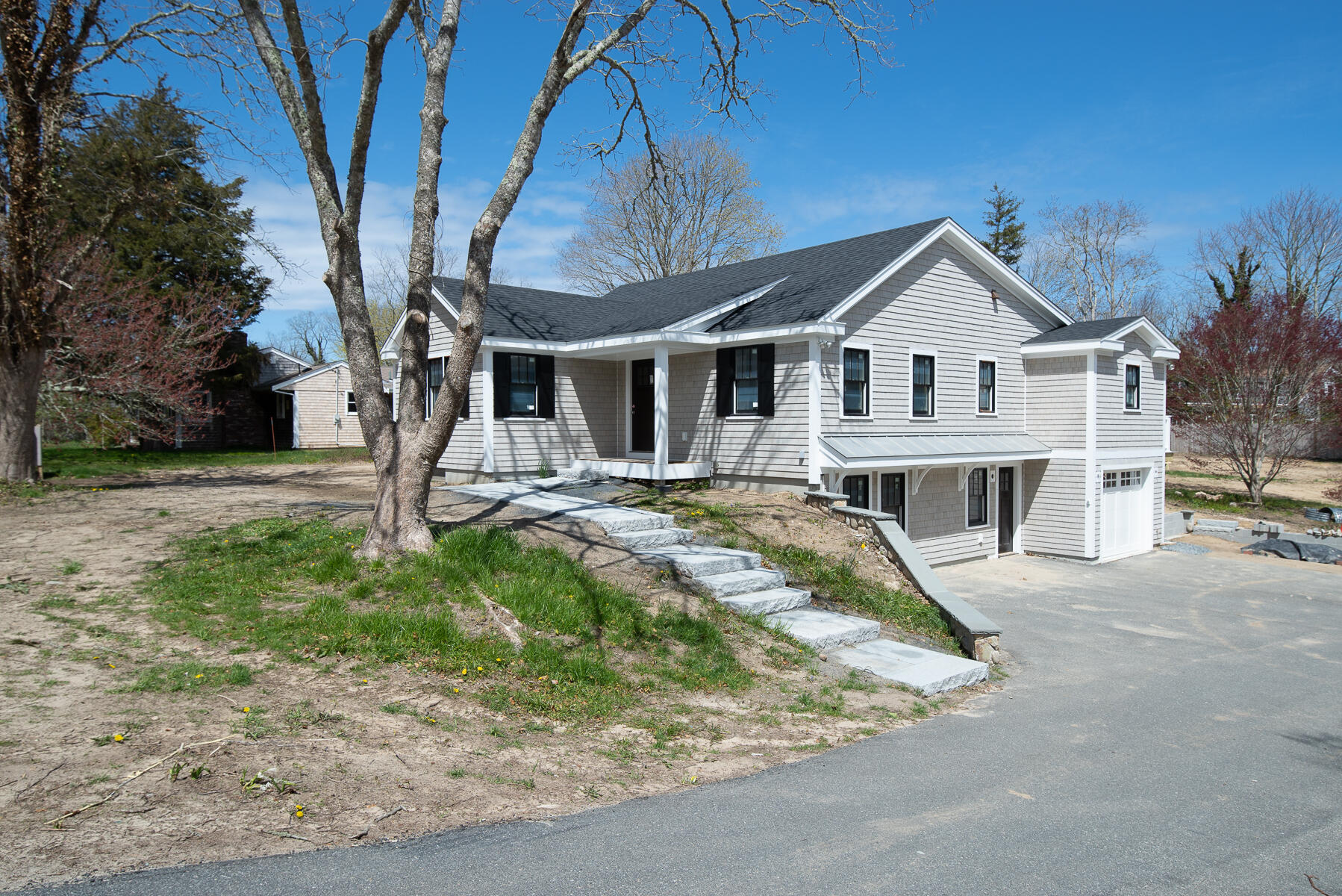86 West Road Orleans, MA 02653 - Photo 3 of 16 a front view of a house with garden